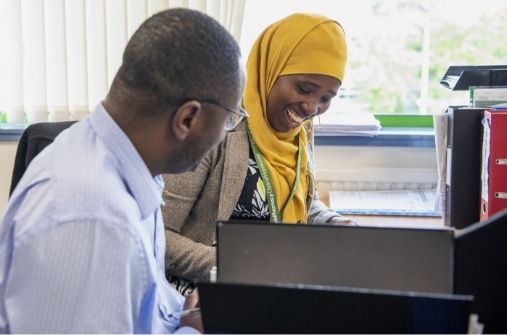 A team member being coached by a mentor